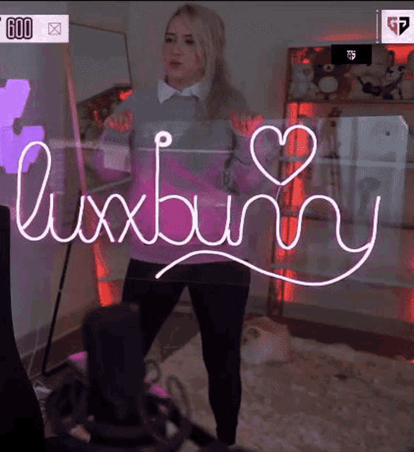 a woman is standing in front of a sign that reads luxbunny