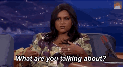 a man and a woman are sitting at a table and the woman is asking the man what are you talking about
