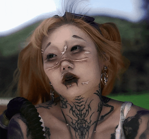 a woman with a tattoo on her neck looks like a zombie
