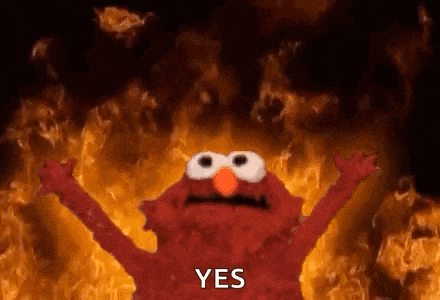 elmo from sesame street is standing in front of a wall of flames and says yes .