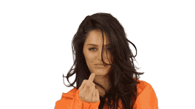 a woman with long dark hair wearing a bright orange hoodie