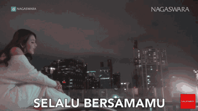 a woman sits on a rooftop with the words selalu bersamamu written on the bottom
