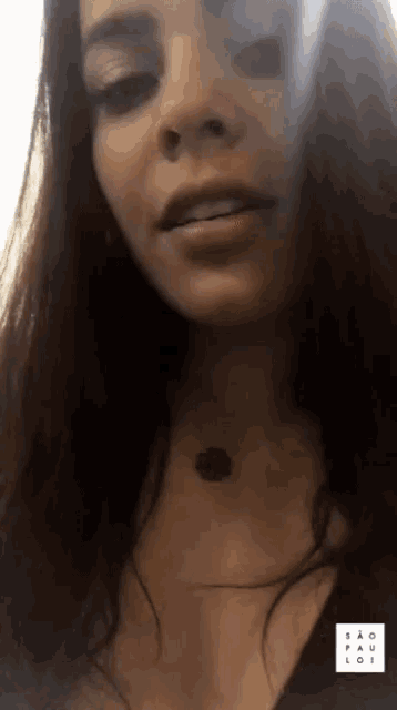 a close up of a woman 's face with sao paulo written on the bottom right
