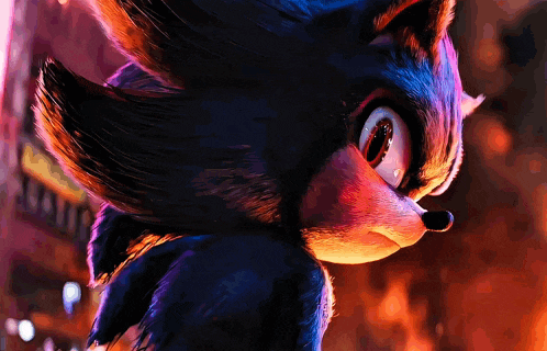 a close up of sonic the hedgehog 's face with a blurred background