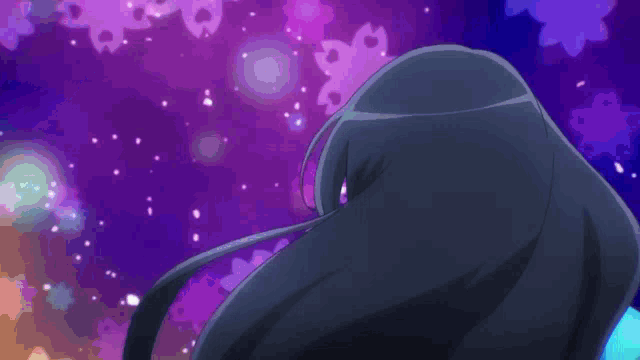 a person in a blue and purple outfit is standing in the dark