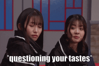 two girls are sitting next to each other with the words questioning your tastes behind them