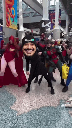 a group of people dressed up in costumes with one wearing a hat that says blizzard