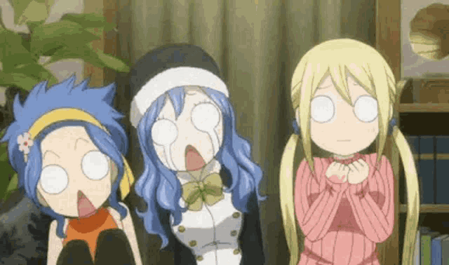 a group of three anime girls are making funny faces while sitting next to each other in a living room .