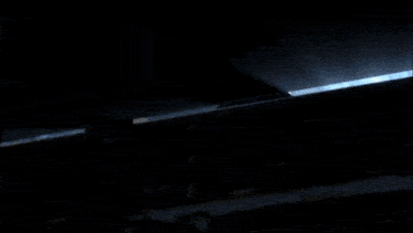 a silhouette of a man in a dark room