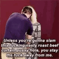 a man is kissing a woman on the cheek while a woman says .