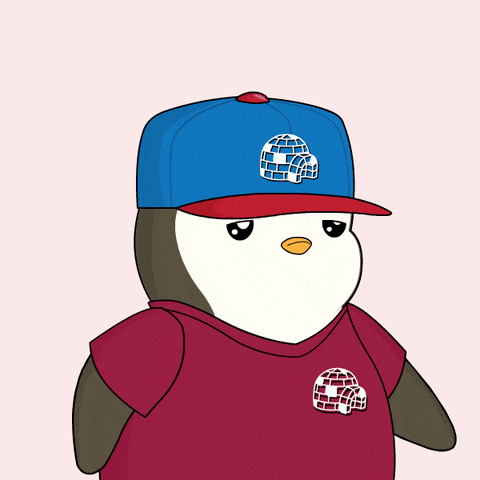 a penguin wearing a blue hat and red shirt