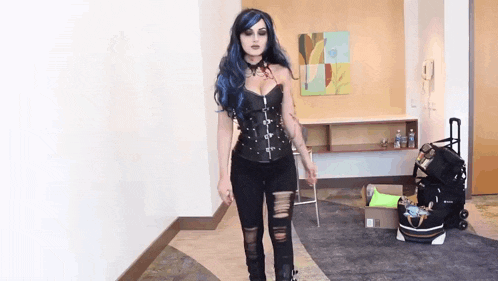 a woman with blue hair and a corset is standing in a hallway
