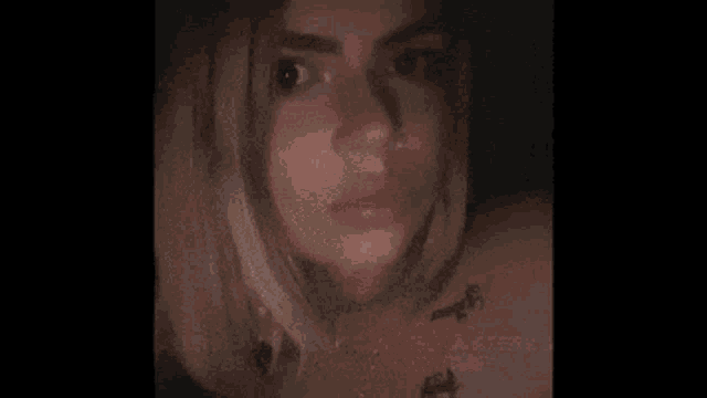 a woman with a nose ring is listening to someone tell a story and being lying the whole time .