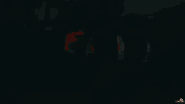 a screen shot of a dark room with a red light coming out of the bottom right