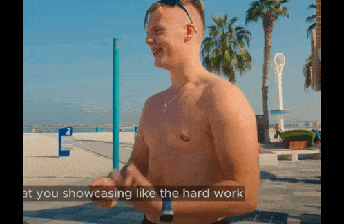 a shirtless man stands on a beach with the words " at you showcasing like the hard work "