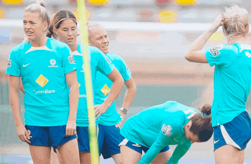 a group of female soccer players wearing shirts that say commer bank