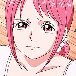 a close up of a girl 's face with pink hair and red eyes