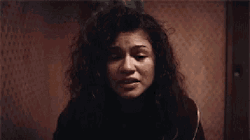 a close up of a woman 's face with tears running down her face