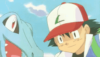 a cartoon character wearing a red and white hat with the letter l on it is standing next to a crocodile .