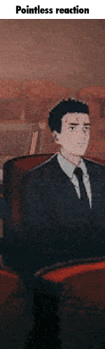 a man in a suit and tie is sitting in a chair with the words pointless reaction above him