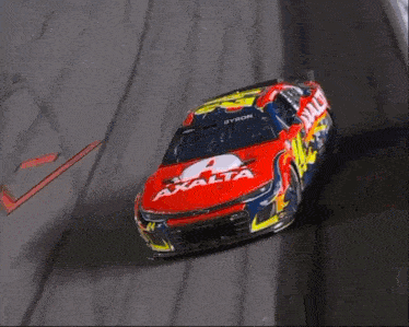 a race car with the number 21 on it is going down a track