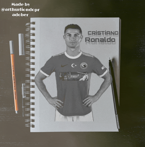 a drawing of cristiano ronaldo is on a spiral notebook