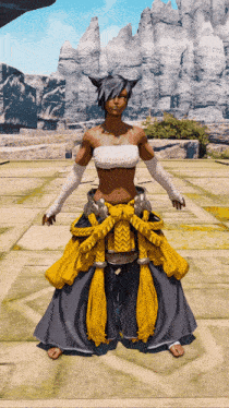 a woman in a yellow and gray outfit stands in front of a mountain range