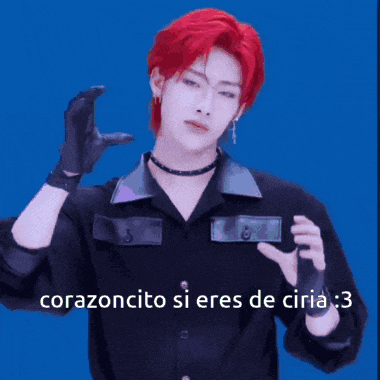 a man with red hair is wearing black gloves and a choker and says " corazoncito si eres de ciria 3 "