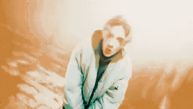 a pixelated image of a man in a white jacket standing on a rock