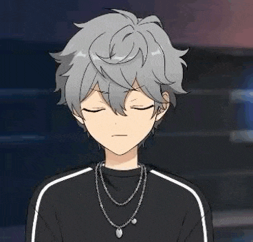 a young boy with gray hair and blue eyes is holding a blue disc in his hand .