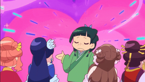 a group of girls are standing around a girl in a green outfit