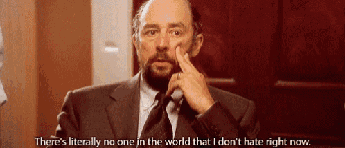 a man in a suit and tie is saying there 's literally no one in the world that i don 't hate right now