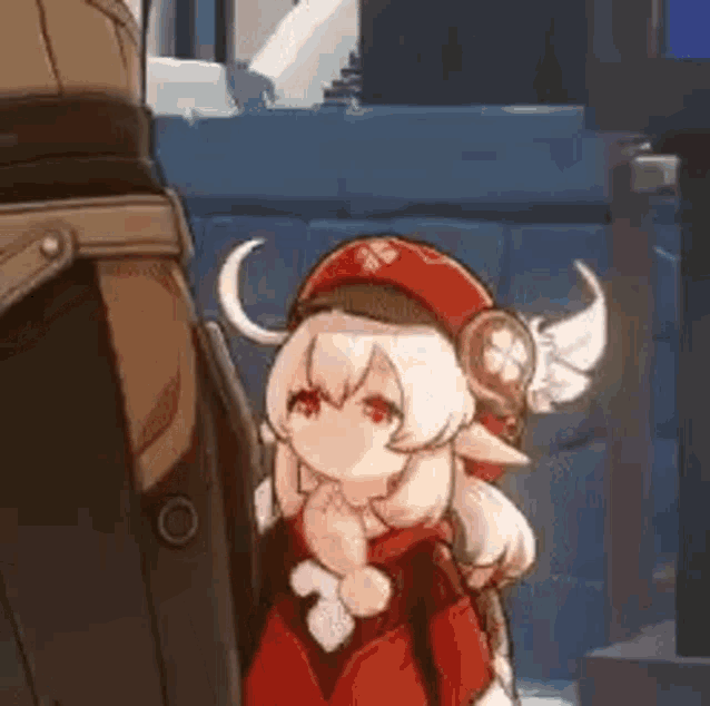 a cartoon girl with wings on her head is standing next to a man .