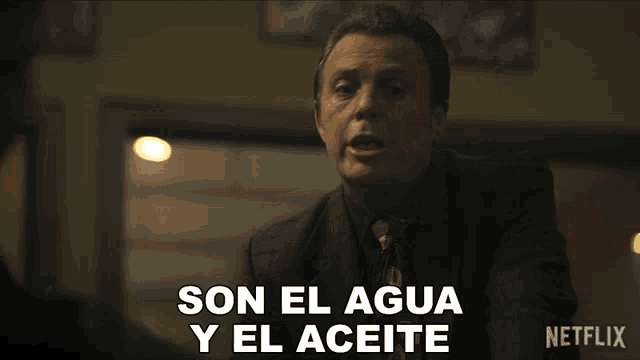 a man says son el agua y el aceite while smoking a cigarette