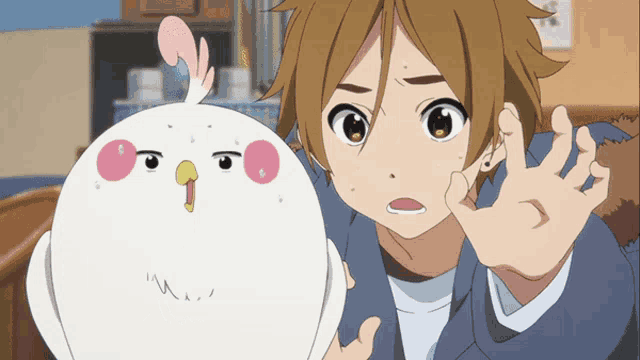 a boy with brown hair is holding a white chicken
