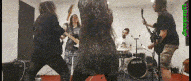 a group of people playing instruments in front of a drum set that says ' drums ' on it