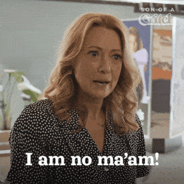 a woman says " i am no ma 'am " in front of a son of a chick poster