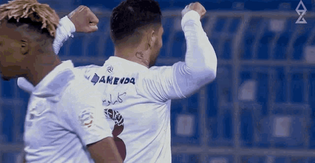 a soccer player wearing a white shirt with the name daneedq on it