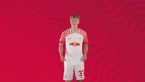 a man in a red and white jersey with the number 30 on his shorts
