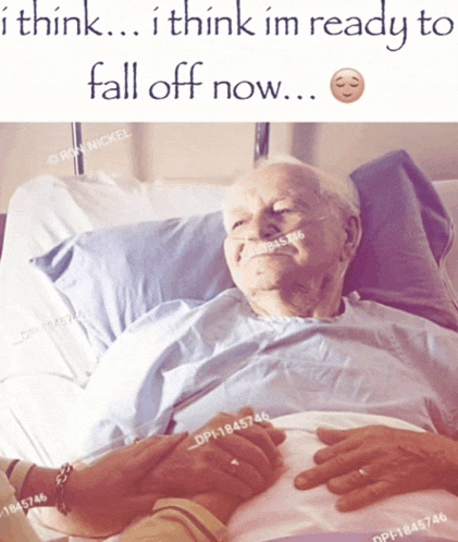 an elderly man is laying in a hospital bed with a person holding his hand