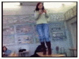 a blurry picture of a girl standing on a table