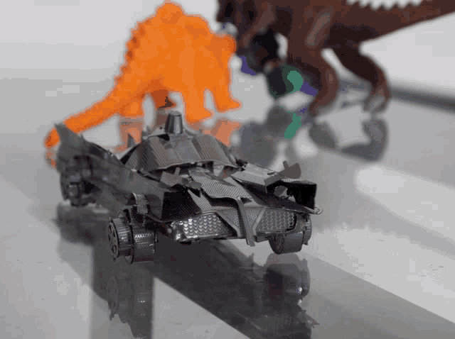 a toy batman car is sitting on a table