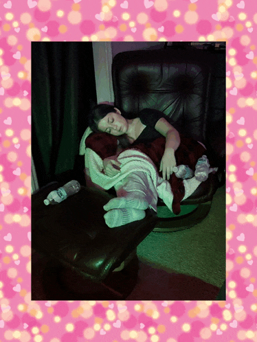 a woman is sleeping on a couch with a bottle of aquafina water on the table
