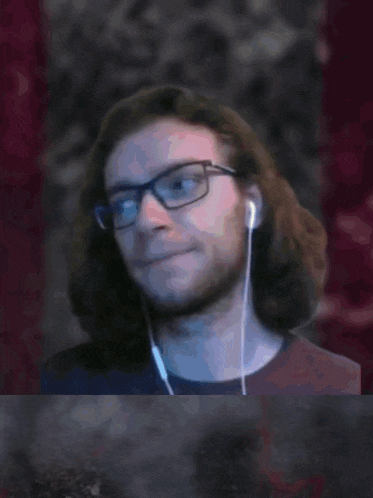 a picture of a man with glasses and ear buds with the words tady je sus below him