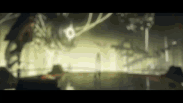 a blurry picture of a person standing in a room with a giant robot in the background .