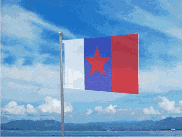 a blue white and red flag with a red star on it