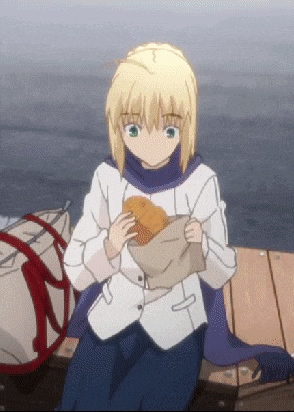 a girl with blonde hair is sitting on a dock eating a sandwich