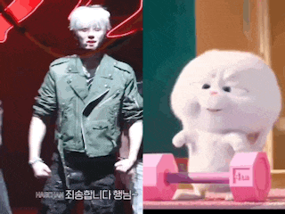 a man and a stuffed animal are standing next to each other .