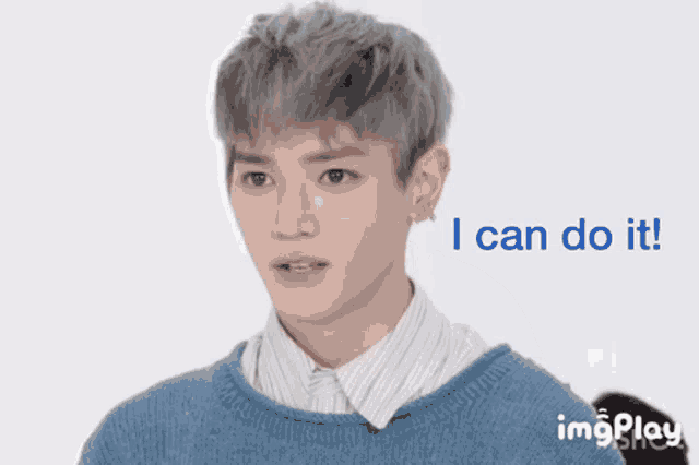 a man in a blue sweater with the words i can do it below him