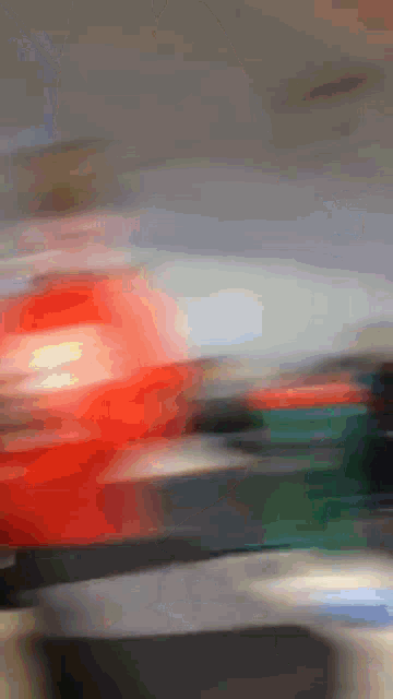 a blurry picture of a car driving down a street